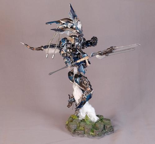 Mecha with 3 sections in the legs leaping of the ground with Lance in hand