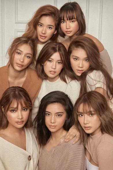 Photo of the 8 BINI girls in some tinge of brown: Aiah, Gwen, Jhoanna, Maloi, Stacey, Colet, Mikha, and Sheena. BINI is a Filipino girl group famous for its hit songs "Pantropiko" (Tropical) and "Salamin, Salamin" (Mirror, Mirror)