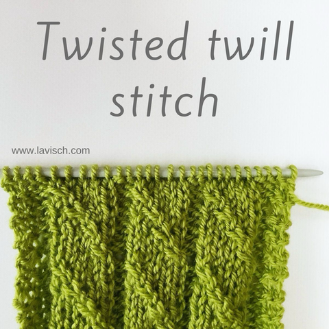A swatch in green yarn on a knitting needle that shows the twisted twill stitch pattern 