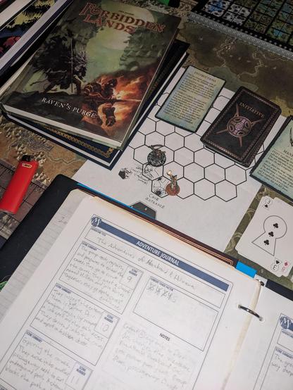 A hex-flower map with a wizard and a goblin miniature, representing an orc because I haven't painted the orcs yet, shown delving into Numera's Caves under King's Bay. A dungeon crawl portion of the TTRPG has commenced and not gone well for the protagonists. A strangling vine and flooding waters threaten all the minis. Surrounding the hex-flower are Forbidden Lands books, playing cards, a bic lighter, and a Trapper Keeper with Mythic GM pages showing. Underneath it all is a map of the Forbidden Lands. Misty hues and luscious density.