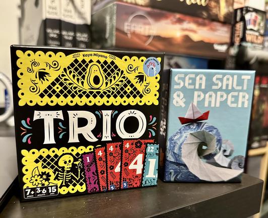 The card games Trio and Sea Salt & Paper. 