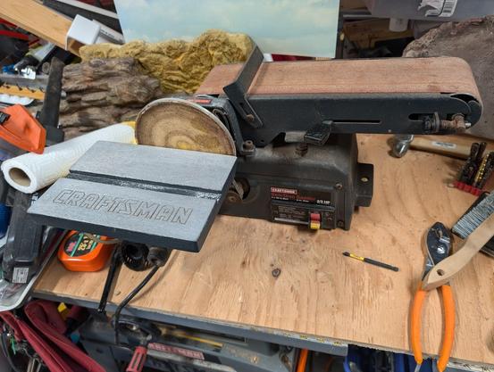 A Craftsman brand bench combo belt/disk sander post clean-up, still looking a bit rusty and gross in places, but MUCH cleaner than my previously posted photo.