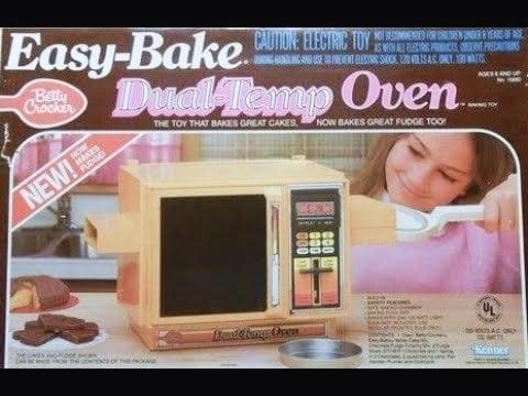 An 80s advert for the Easy-Bake Dual-Temp Oven

THE TOY THAT BAKES GREAT CAKES.
NOW BAKES FUDGE TOO!

From Betty Crocker 

CAUTION ELECTRIC TOY

(image of a girl dressed in pink, smiling as she slips her cake into the mini oven)