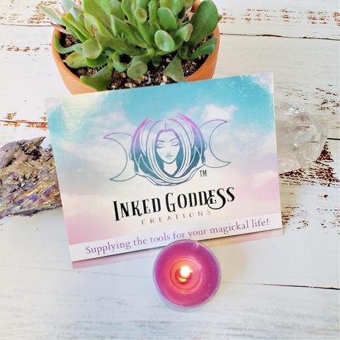 A photo of a physical representation of a digital Inked Goddess Creations Gift Card, featuring our logo and tagline, "Supplying the tools for your magickal life!"