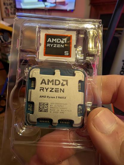 An AMD Ryzen 9600x cpu in clear plastic package