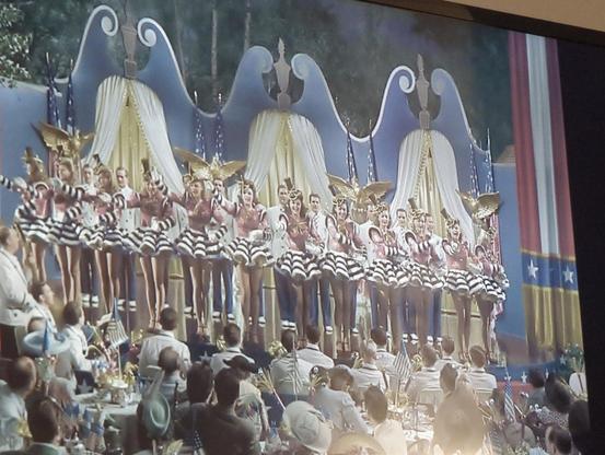 A stage with patriotic decorations and about twenty chorus girls, in HOLIDAY INN. 