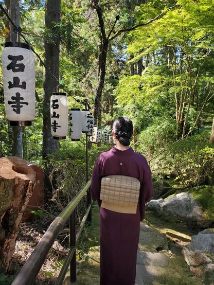 Nao-san navigates the steps that wind down the mountain slope from the precincts of Ishiyama-dera.