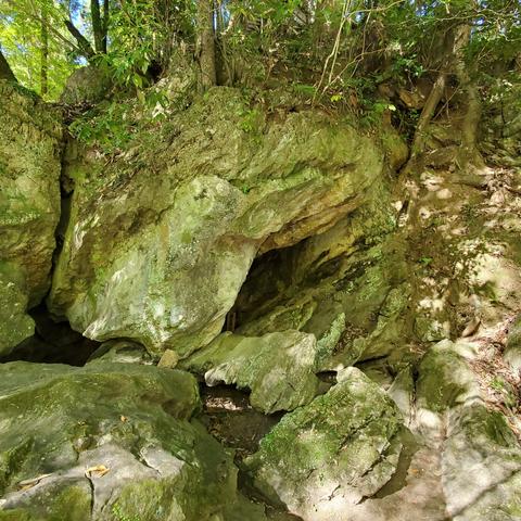 A passage worn into the rocks at the mountain base below Ishiyama-dera's precincts.