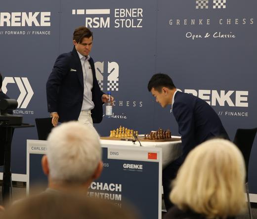 Magnus Carlsen just about to sit down opposite of Ding Liren and play with the white pieces, at Grenke Classic in Karlsruhe.