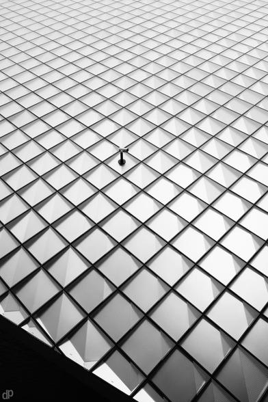 Black and white photography
A camera in the center, on a pattern of quadrats
