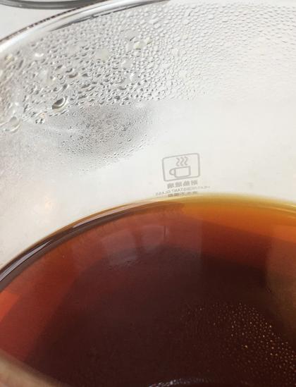 Detail from the inside of the coffee jug showing droplets of water on the inside of the jug with the coffee at the bottom. The condensation around the inside of the coffee comes from the evaporating liquid. But, there is also a link between the physics of this and the greenhouse effect. So much to see in a cup of coffee.