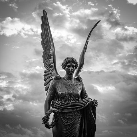 Bronze angel statue at dusk. Orangerie, Park Sanssouci, Potsdam, 17 Nov 2024. Nikon D5600, Nikkor DX 35 mm ƒ1.8G, ISO 125, ƒ7.1, -0.3 ev, 1/80s