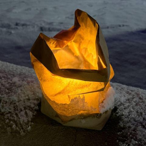 crumpled luminaria against snowy background
