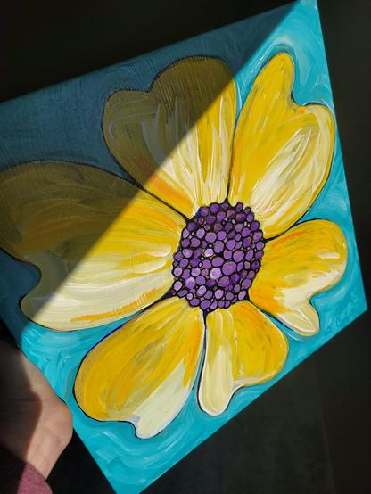 Bright yellow flower with purple center by artist Sharon Cummings.