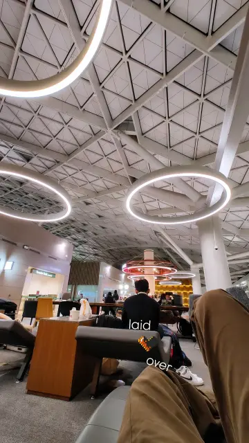 First-person shot of the Transfer Lounge at Incheon International Airport, as seen from one of its leather loungers overnight.