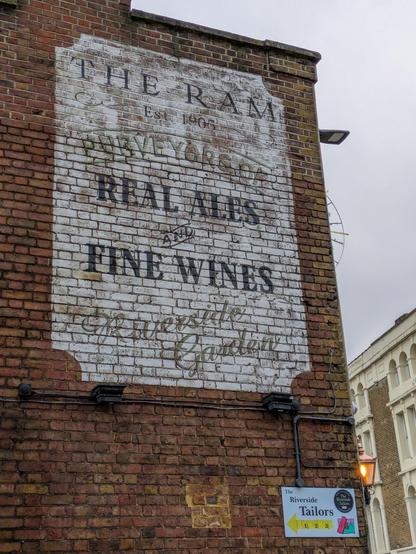 A fading painted pub sign