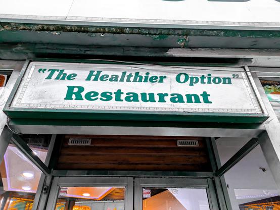 A sign for "the healthier option" restaurant 