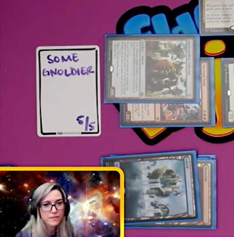 A screen capture of a playmat with Magic cards on it and an InfiniTokens dry erase token that says "Some Gnoldier 5/5".