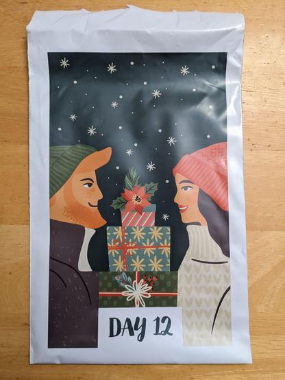 A bog showing two people looking at each other over a stack of presents.