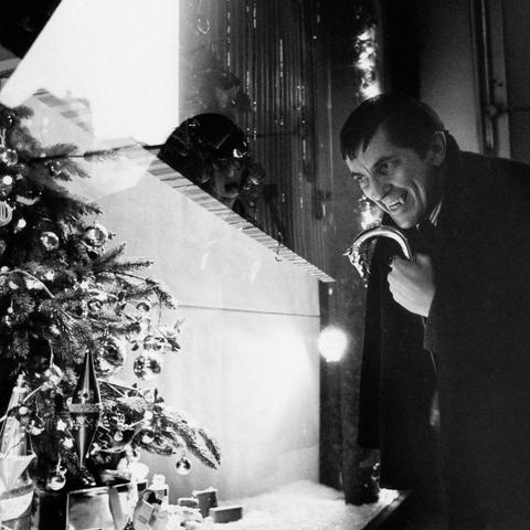 Vampire Barnabas Collins (actor Jonathan Frid) bares his fangs somewhat good-naturedly, it must be said, at Christmas decorations.