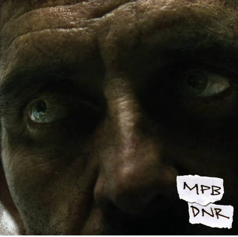 Album cover. DNR by Most Precious Blood. Cover is a close up of a man’s ntense stare 