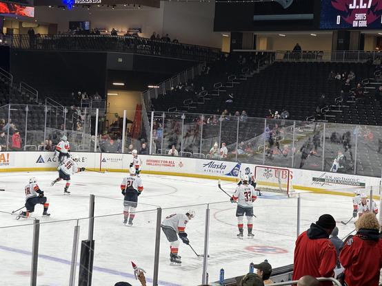 Logan Morrison takes a practice shot on Niko Kokko in warm ups while other Firebirds players watch