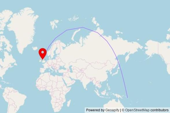 A map showing the great circle route from Honiara in Solomon Islands to a map pin at Saint George's Walk, Douglas, IM1 1JD, Isle of Man