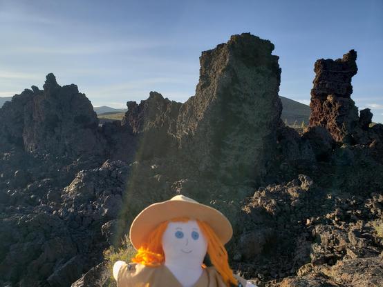 Ranger Sarah looks at the Rafted blocks, or monoliths that came from an unknown cinder cone. Although geologists can't be certain, they now believe that as many as four separate flows came from a vent at or near North Crater.
— at Craters of the Moon NPS.
