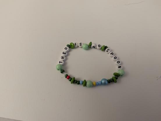 a bracelet with a typo 
saying "ther is no spoon"