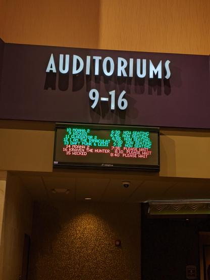 Photo of the cinema auditorium sign with Daft Punks viewing at 7:15 with other movies times.