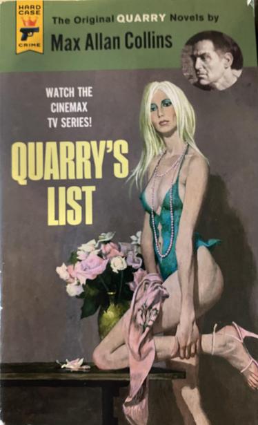 A picture of a hard case crime paperback reprint of “Quarry’s List” by Max Allan Collins. It is styled as a 60’s crime paperback with a painting of a woman with long blond hair in teal negligee and eye makeup who sort of looks like cher. She has a knee resting on a table with flowers on it. The cover blub advertises the cinemax show based on the series of novels. 