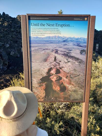 Ranger Sarah finished the North Crater Flow Trail and reads the last sign along the trail.
— at Craters of the Moon NPS.