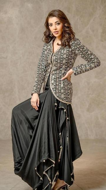 Kajal Aggarwal stuns in a flawless SVA contemporary fusion ensemble. Featuring innovative cuts and intricate detailing, this outfit is a true masterpiece that highlights Kajal Aggarwal’s beauty and SVA’s modern approach to couture.