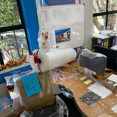 🎄🎉 DAY 5 of Banjo and Elfie’s office mischief! 🎉🎄 They’ve wrapped Rianette’s desk in bubble wrap to celebrate her as our ultimate cyber protection hero! 💻🛡️ These two are always finding creative ways to show appreciation (and have a little fun)! 💥✨  Stay tuned for more festive shenanigans! 🎅  #BabyYumYum #BYY #ElfOnASelf #BanjoAndElfie #OfficeShenanigans #CyberHero #HolidayFun #FestiveVibes