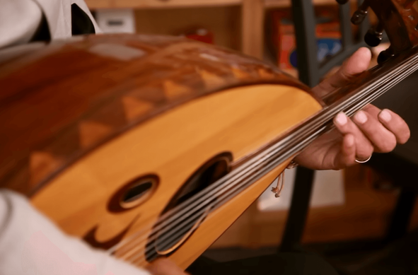 A Syrian oud player performs on stage in NPR Radio