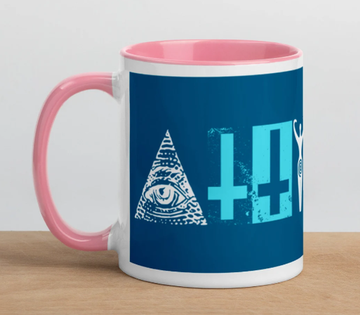 white mug, pink handle, inside and rim
printed: the illimunati pyramid eye (the A), 2 upside down crosses (the 11) and the pagan fertility goddess symbol (the Y) on a mid blue background