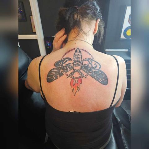Photo of new tattoo on my upper back - it's the logo of Bray Wyatt & is an upside down, stylised Deaths Head Hawk moth.