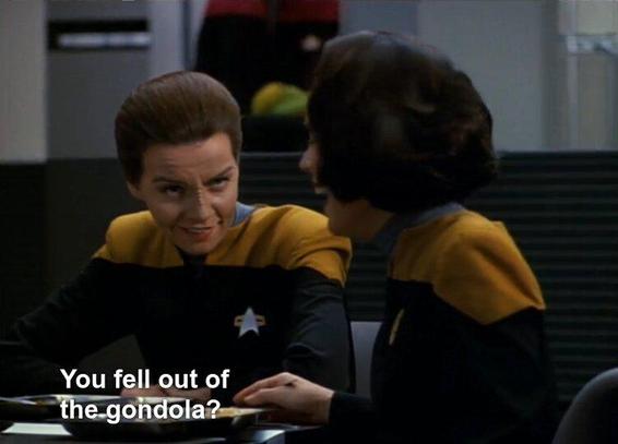 Star Trek Voyager screengrab: Seska (still all starfleety), is talking to B'Elanna at a mess halb table, all conspiratorily. Per closed caption, somebody can't believe it: "You fell out of the gondola?" and B'Elanna is loling
