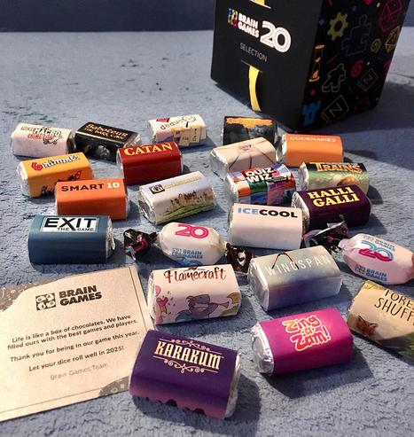 A Christmas gift from Brain Games inc: lots of candy wrapped in a BG board game colors + logos wrappers: Codenames, Carcassonne, Flamecraft, Karakum, Wingspan, etc