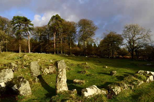 Granite building remains under winter sun.