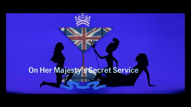The image features a blue background with silhouettes of three women, one holding a trident, and a large martini glass displaying the Union Jack. The text "On Her Majesty's Secret Service" is prominently displayed below.