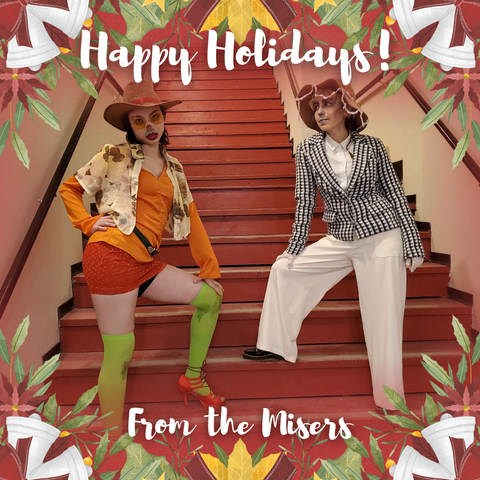A tacky Christmas card with a thick border of bells and poinsettas and other crowded, festive things. In the middle of the card, Kaleidoscope Crush is dressed as Heatmiser with a wide-brimmed hat, yellow glasses, and a sparkly red nose. Austin Tacious is dressed as Snowmiser, with icing-like lace on his hat, and a sparkly blue nose. They are both posed on a long set of stairs, each with one bent leg. The cursive text reads "Happy Holidays! From the Misers."