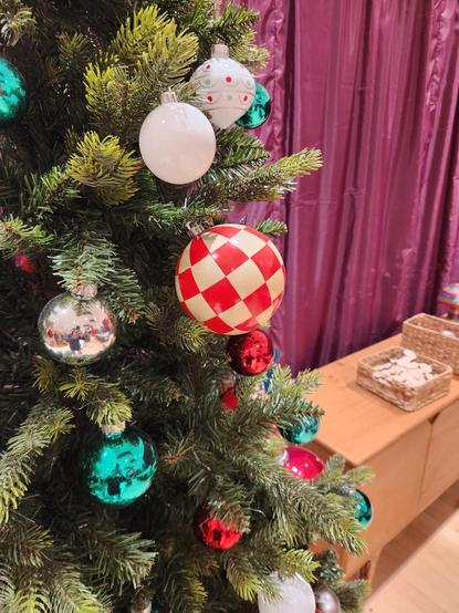 A christmas tree with a bauble that looks exactly like an Amiga Boing Ball