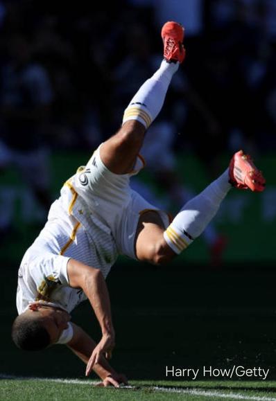 Dejan Joveljic is seen upside down while attempting to cartwheel in a goal celebration at the MLS Cup final. Photo courtesy Harry How/Getty