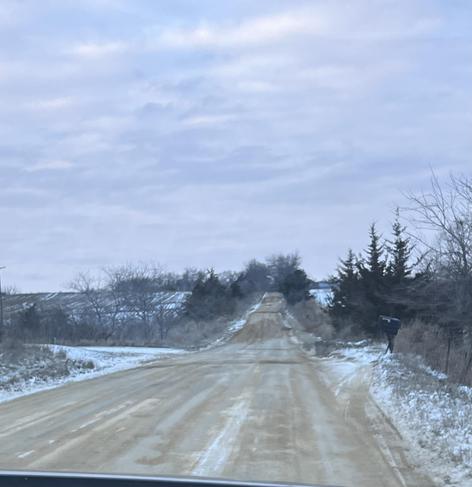 Coming down our dirt road toward home. The snow covered fields stretch on both sides; no deer in the picture today. 