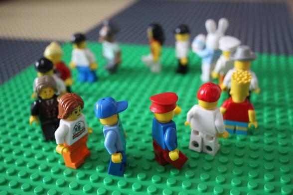 Picture of a group of Lego Minifigs, running in a Circle