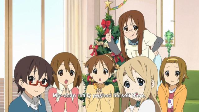 A group of five girls and a woman looking at her with different impressed, surprised, or grinning expressions while someone say, “Mio-chan really pushed herself there.”