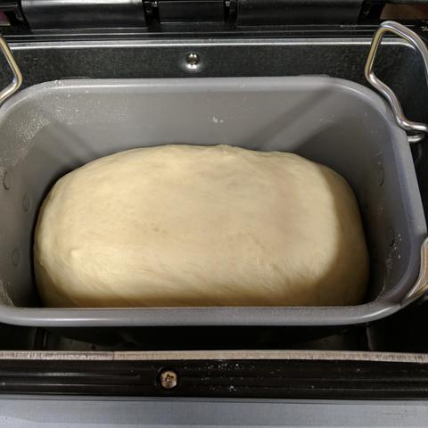 Dough in a bread machine after the dough cycle has finished. It looks perfect.