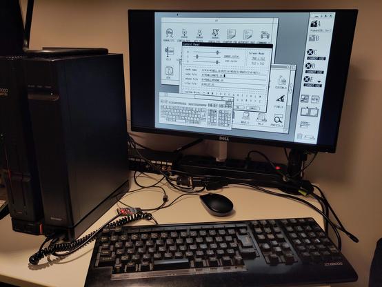 Device-under-test. The X68000 Expert HD is on the desk now, with the original keyboard, and the adapter with a black Raspberry Pi mouse. The Human68k 2.0 Visual Shell is running from a floppy disk, with several windows open, that require the use of the mouse. It works!