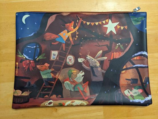 A large project bag with a picture of various woodland cretures decorating and enjoying the holidays together.
